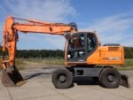 Pelle sur pneus Doosan DX170W 2009 – 17,7T – 5253h – Occasion